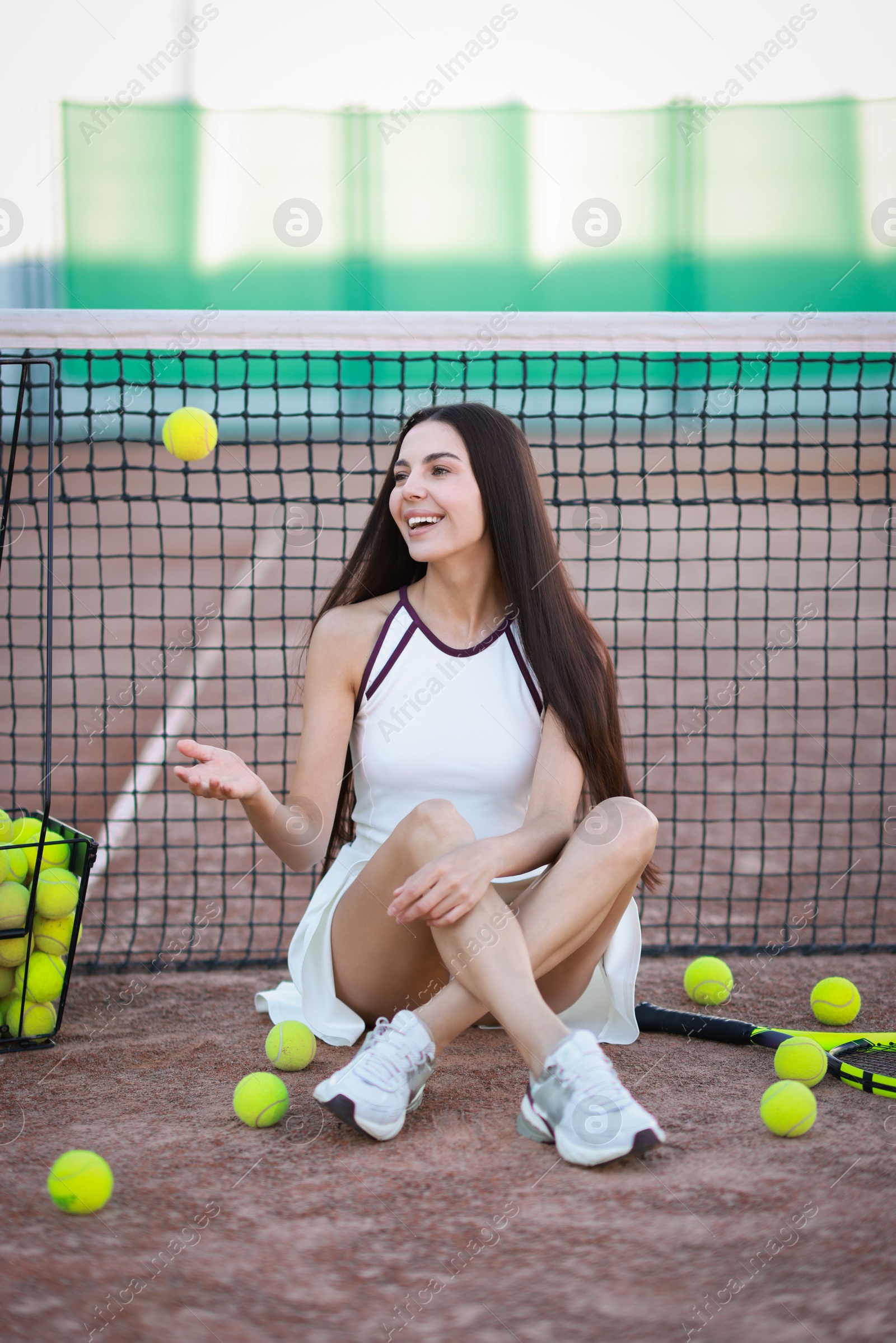 Photo of Beautiful woman in sportswear on tennis court