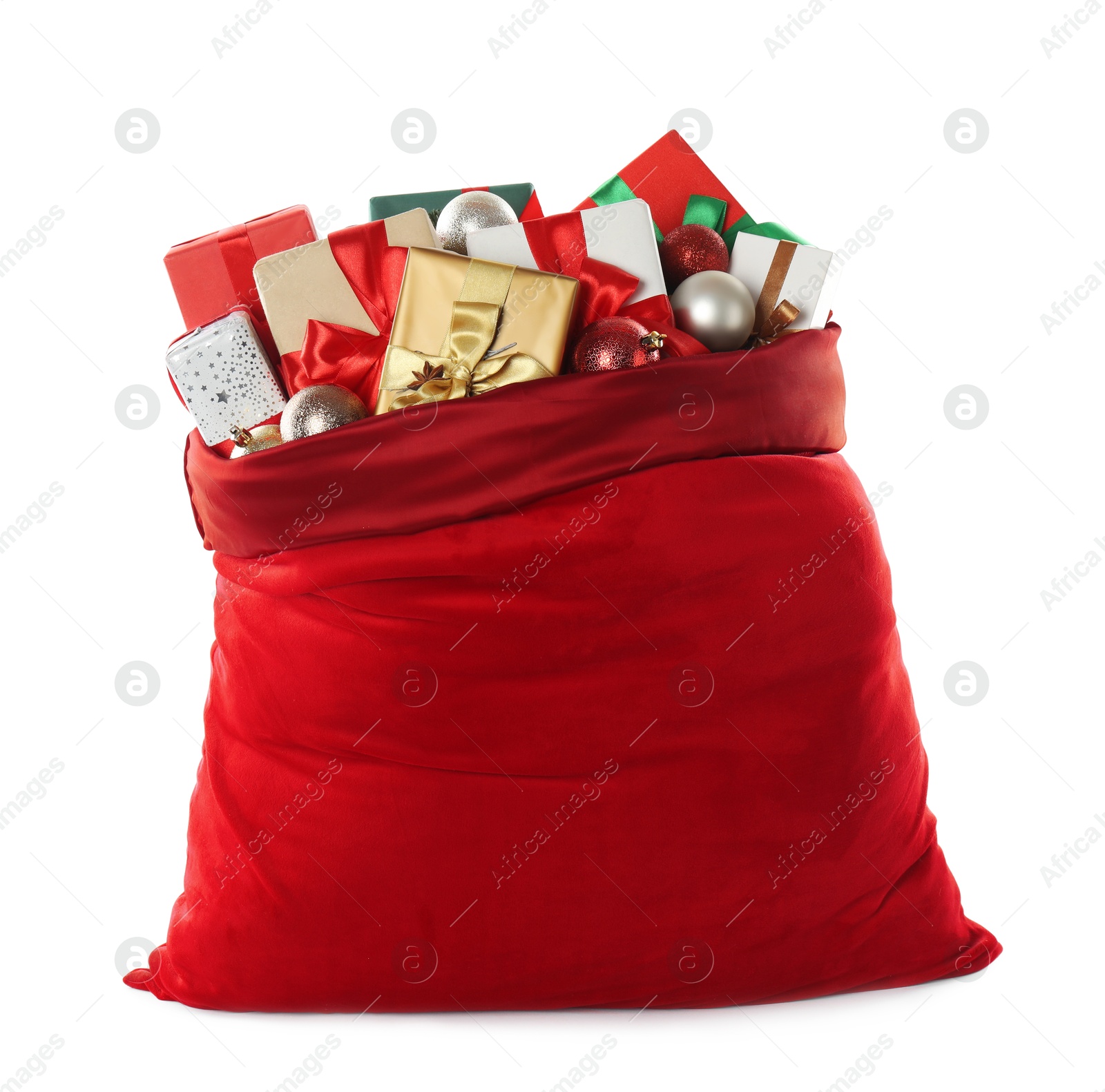 Photo of Santa Claus bag with gift boxes and Christmas balls isolated on white