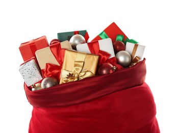 Photo of Santa Claus bag with gift boxes and Christmas balls isolated on white