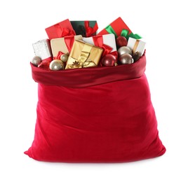 Photo of Santa Claus bag with gift boxes and Christmas balls isolated on white