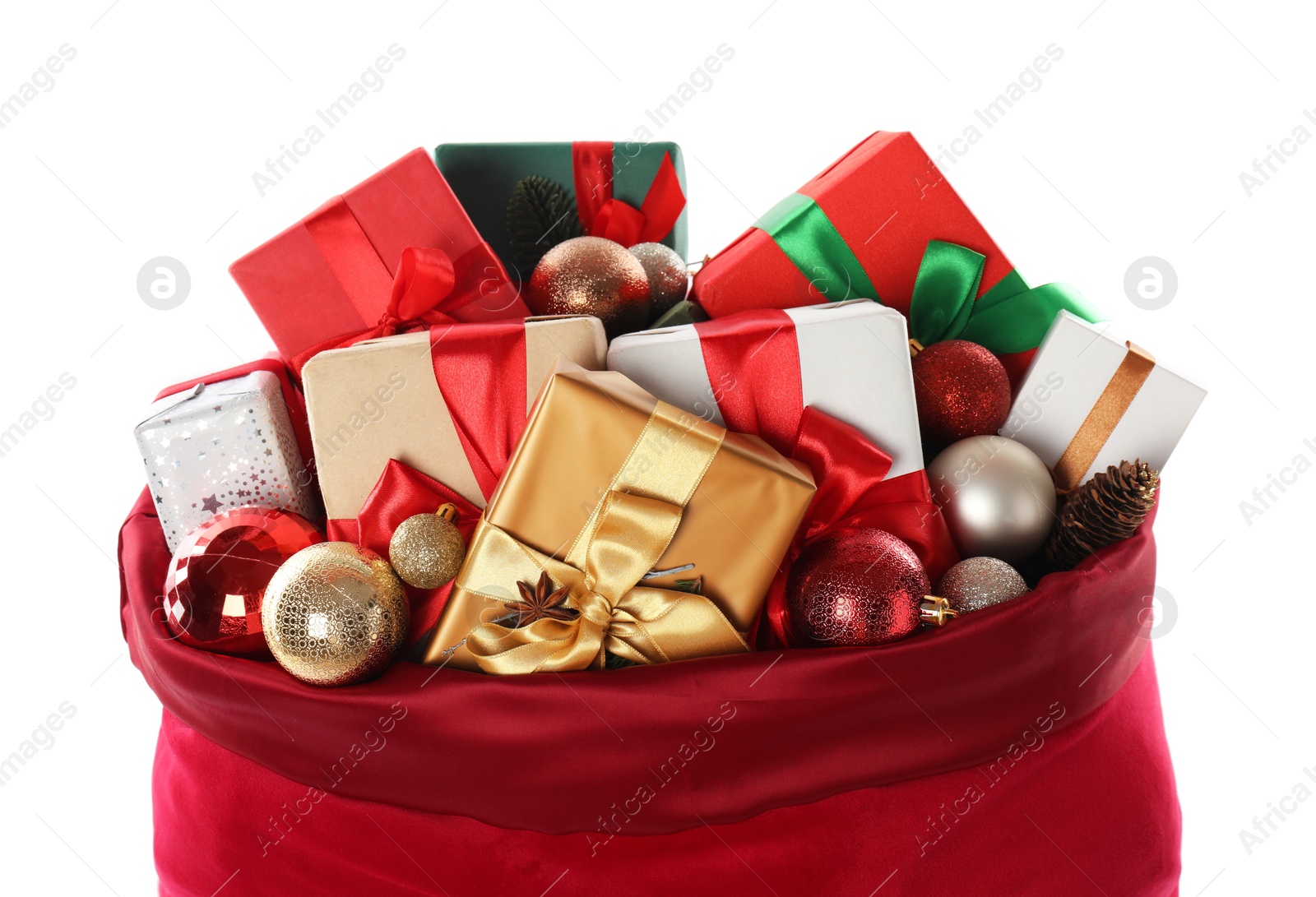 Photo of Santa Claus bag with gift boxes and Christmas balls isolated on white