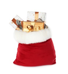 Photo of Santa Claus bag with gift boxes isolated on white