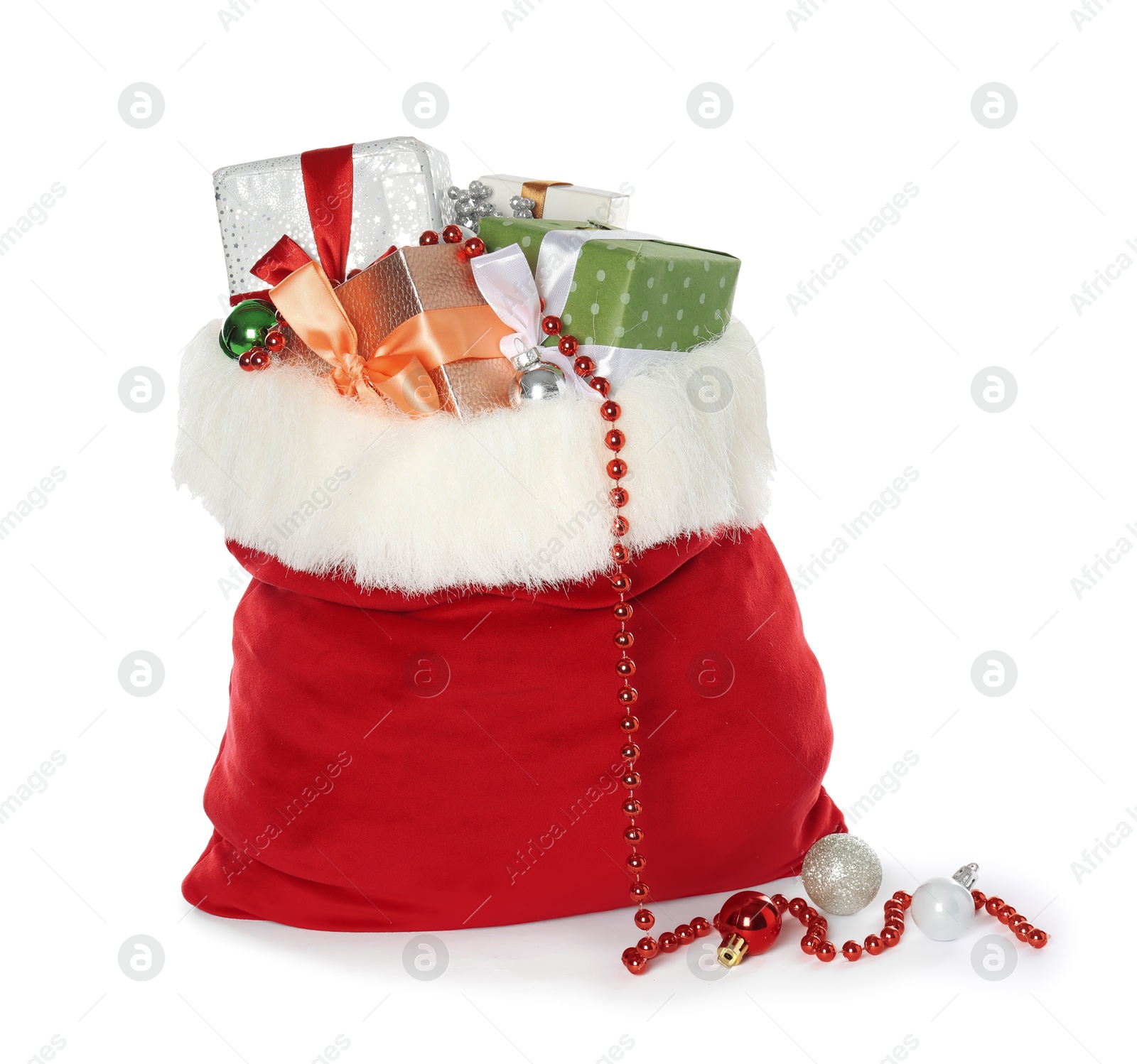 Photo of Santa Claus bag with gift boxes and Christmas balls isolated on white