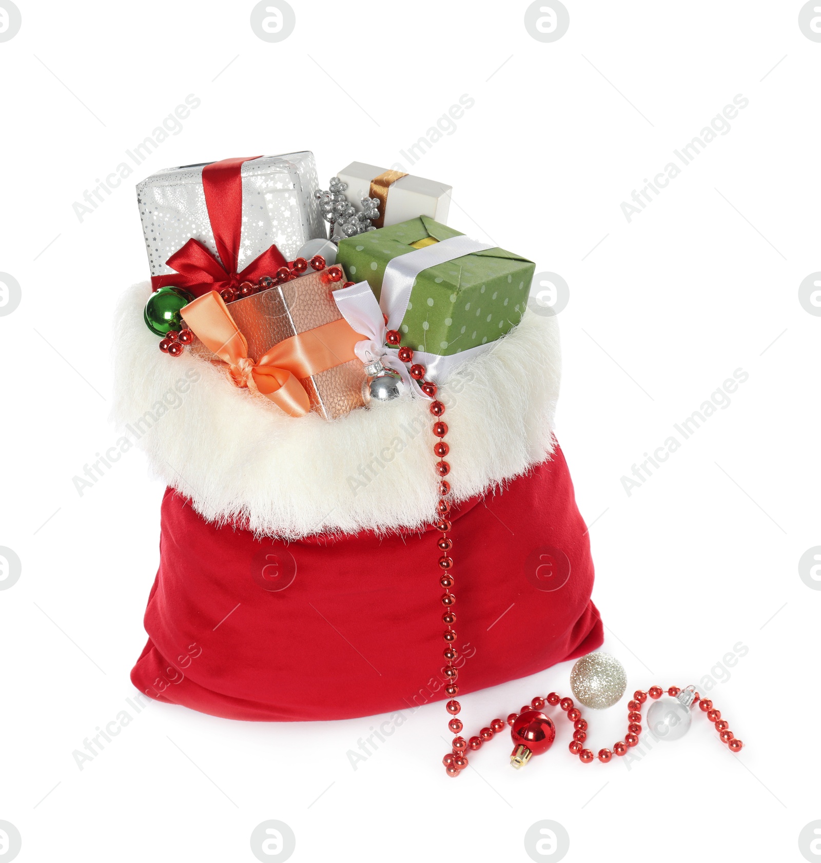 Photo of Santa Claus bag with gift boxes and Christmas balls isolated on white