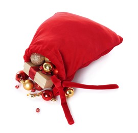 Photo of Santa Claus bag with gift boxes and Christmas balls isolated on white, above view