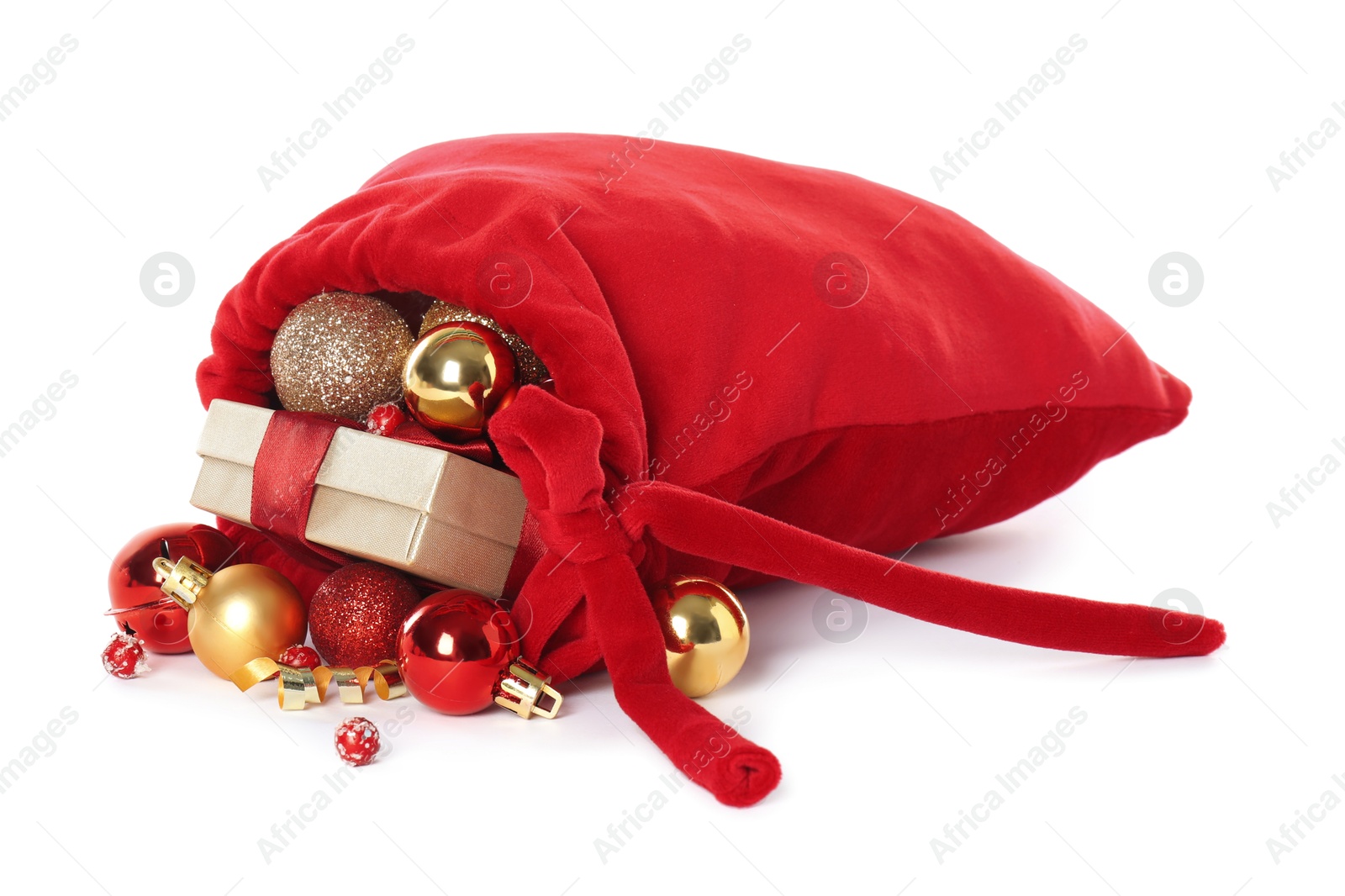 Photo of Santa Claus bag with gift boxes and Christmas balls isolated on white