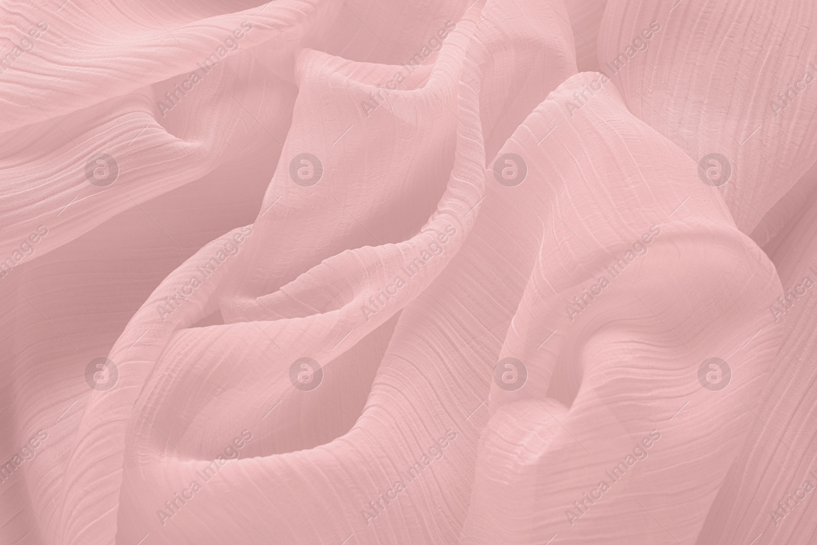 Image of Beautiful pink beige tulle, closeup view of fabric