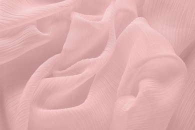 Image of Beautiful pink beige tulle, closeup view of fabric