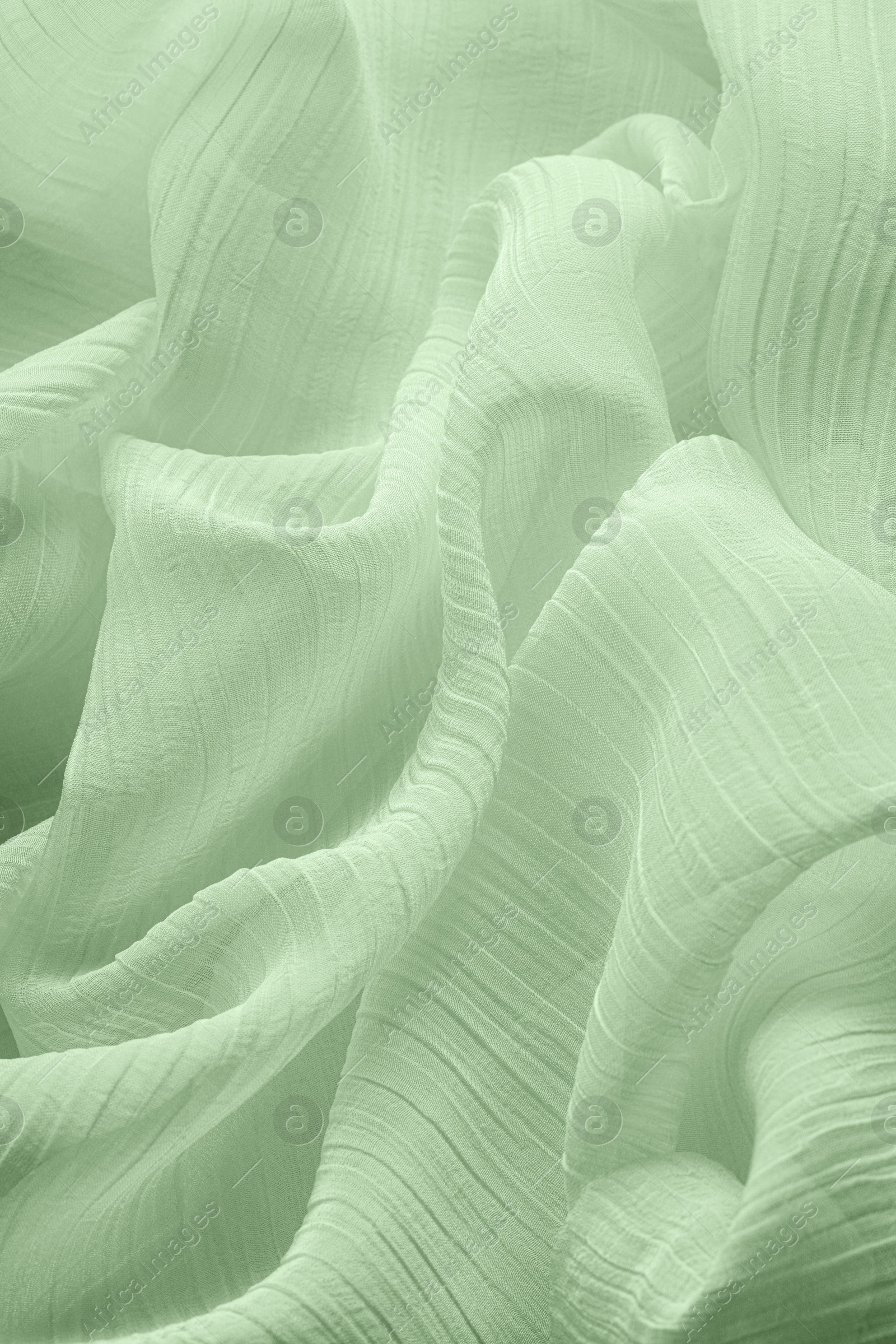 Image of Beautiful pale green tulle, closeup view of fabric