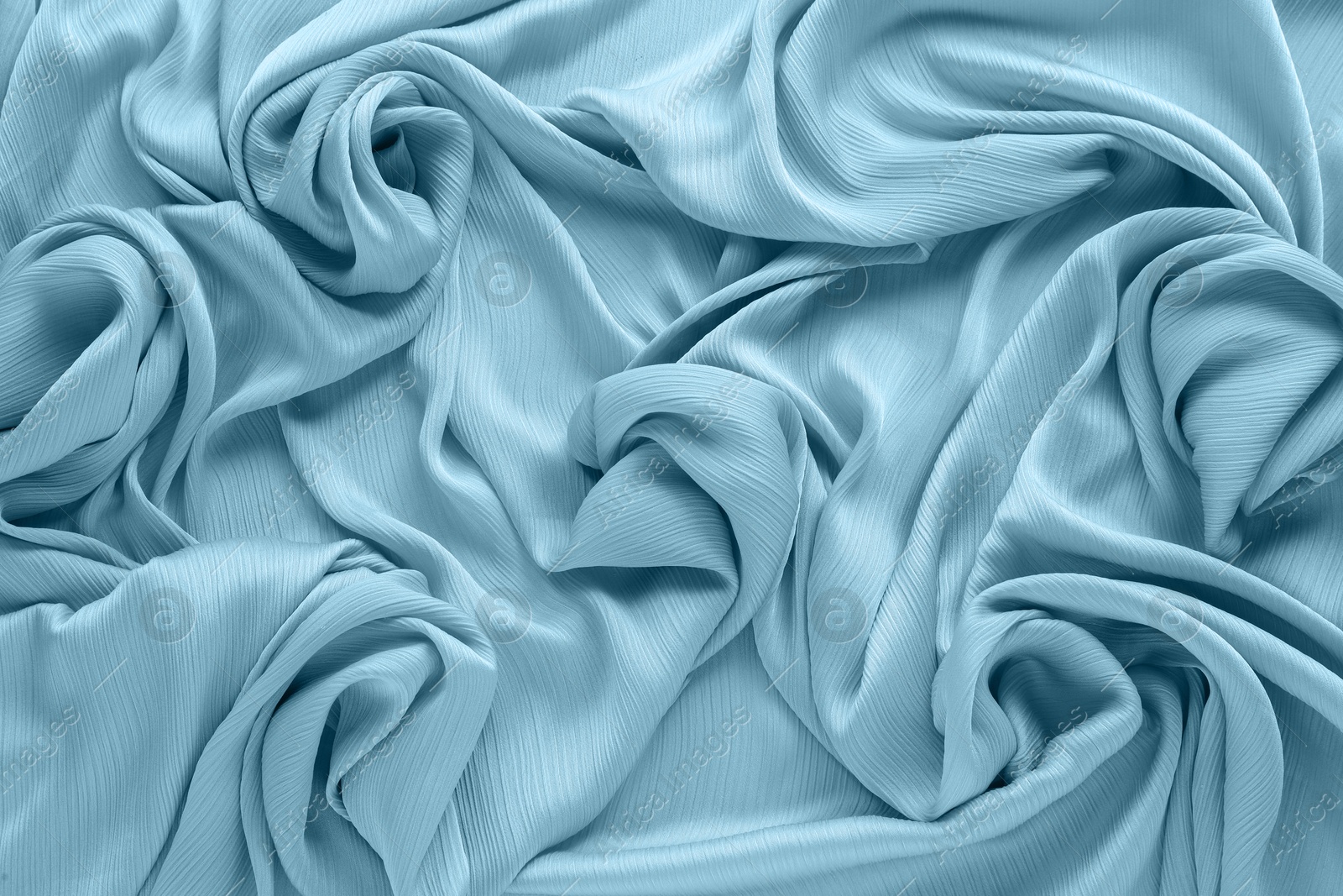 Image of Beautiful steel blue color tulle, closeup view of fabric