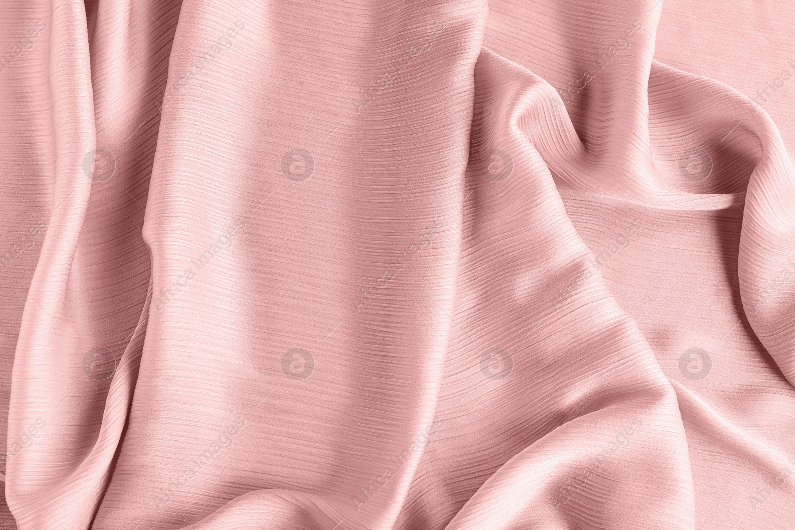 Image of Beautiful pink beige tulle, closeup view of fabric