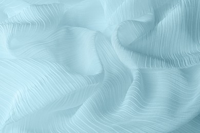 Image of Beautiful sky blue color tulle, closeup view of fabric