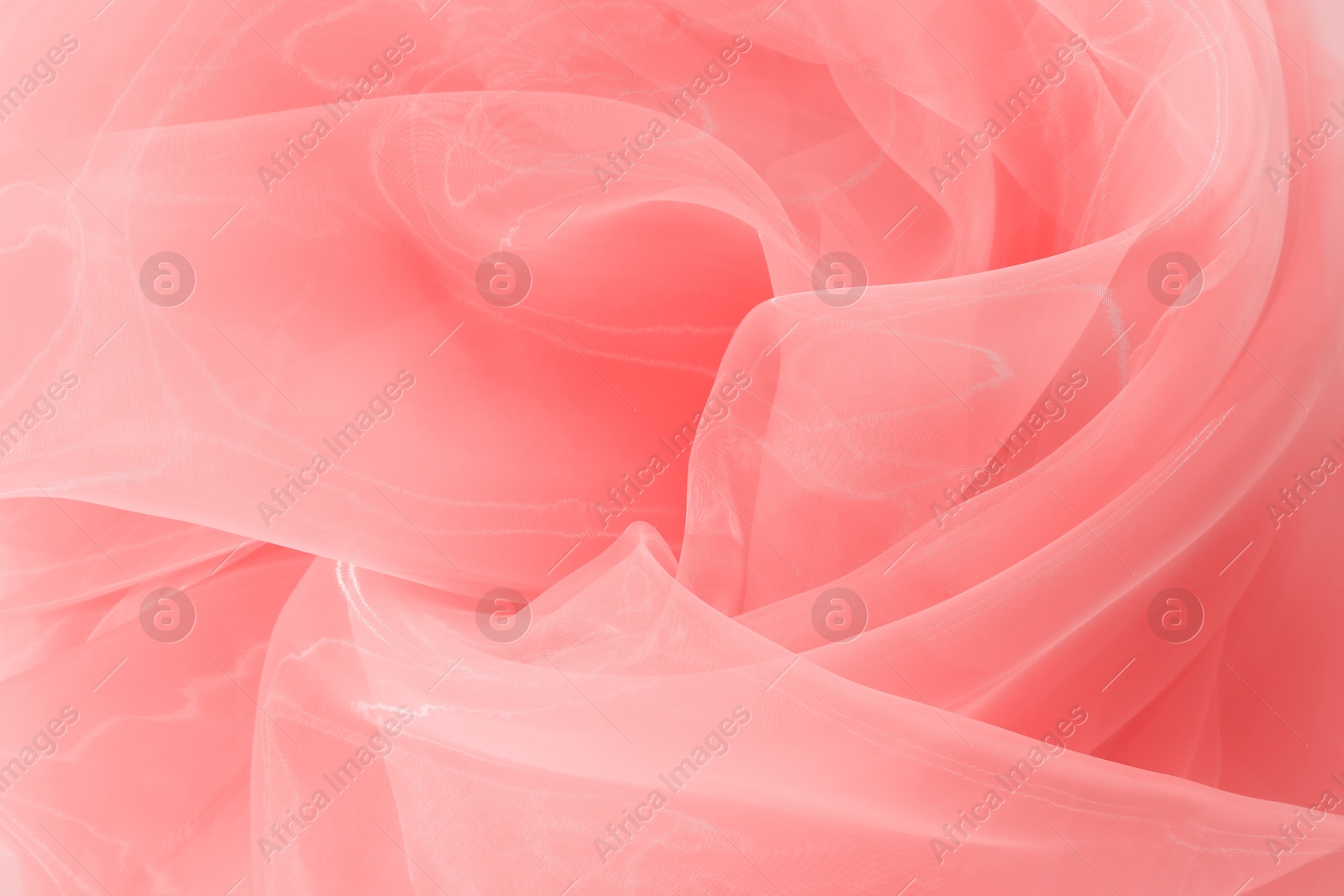 Image of Beautiful salmon color tulle, closeup view of fabric