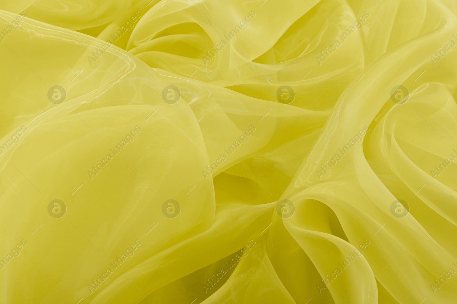 Image of Beautiful yellow tulle, closeup view of fabric