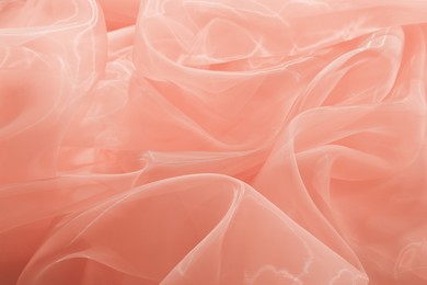 Image of Beautiful coral color tulle, closeup view of fabric