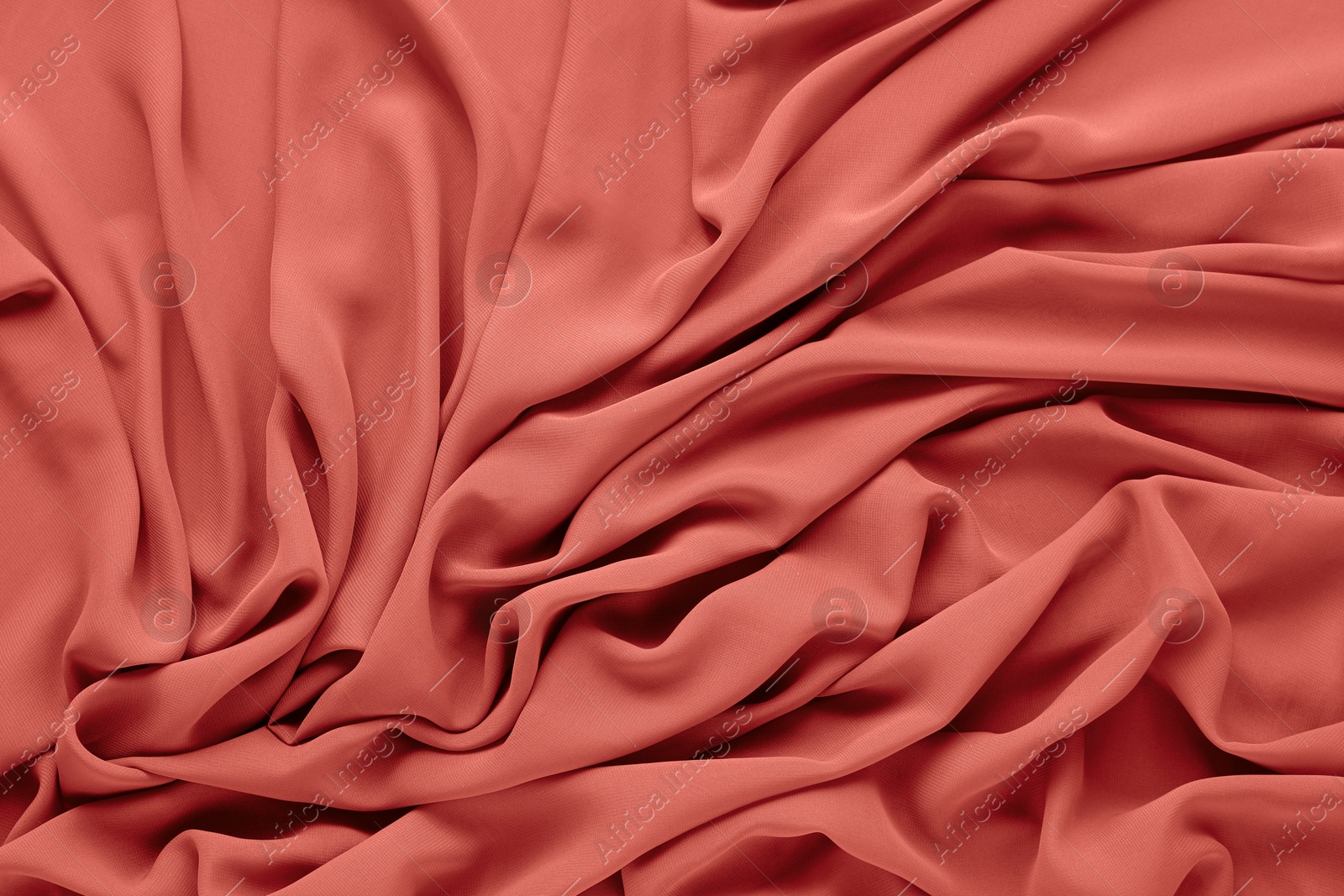 Image of Beautiful coral color tulle, closeup view of fabric