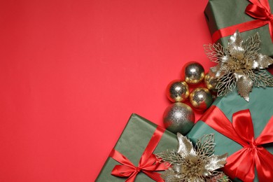 Photo of Flat lay Christmas composition with festive decor on red table, space for text