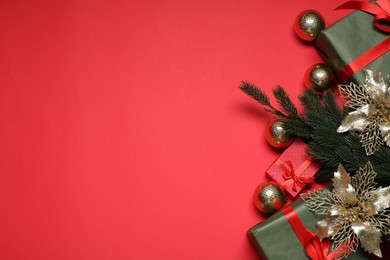 Photo of Flat lay Christmas composition with festive decor on red table, space for text