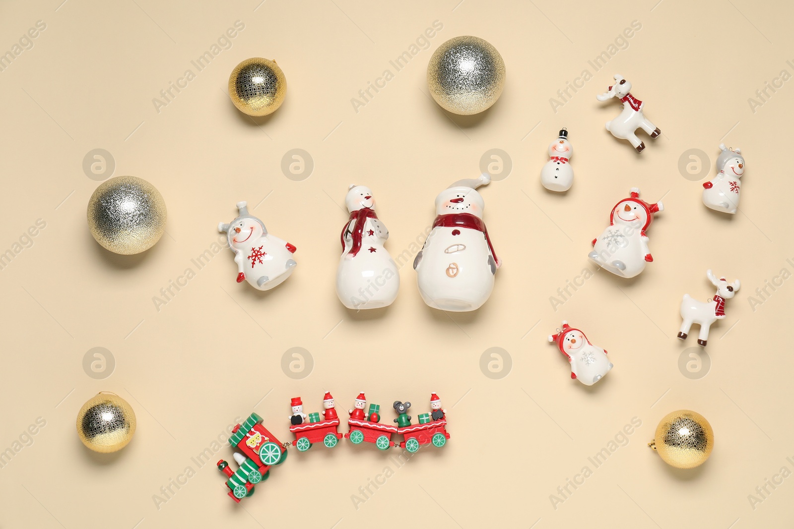 Photo of Flat lay composition with different Christmas decor on beige background