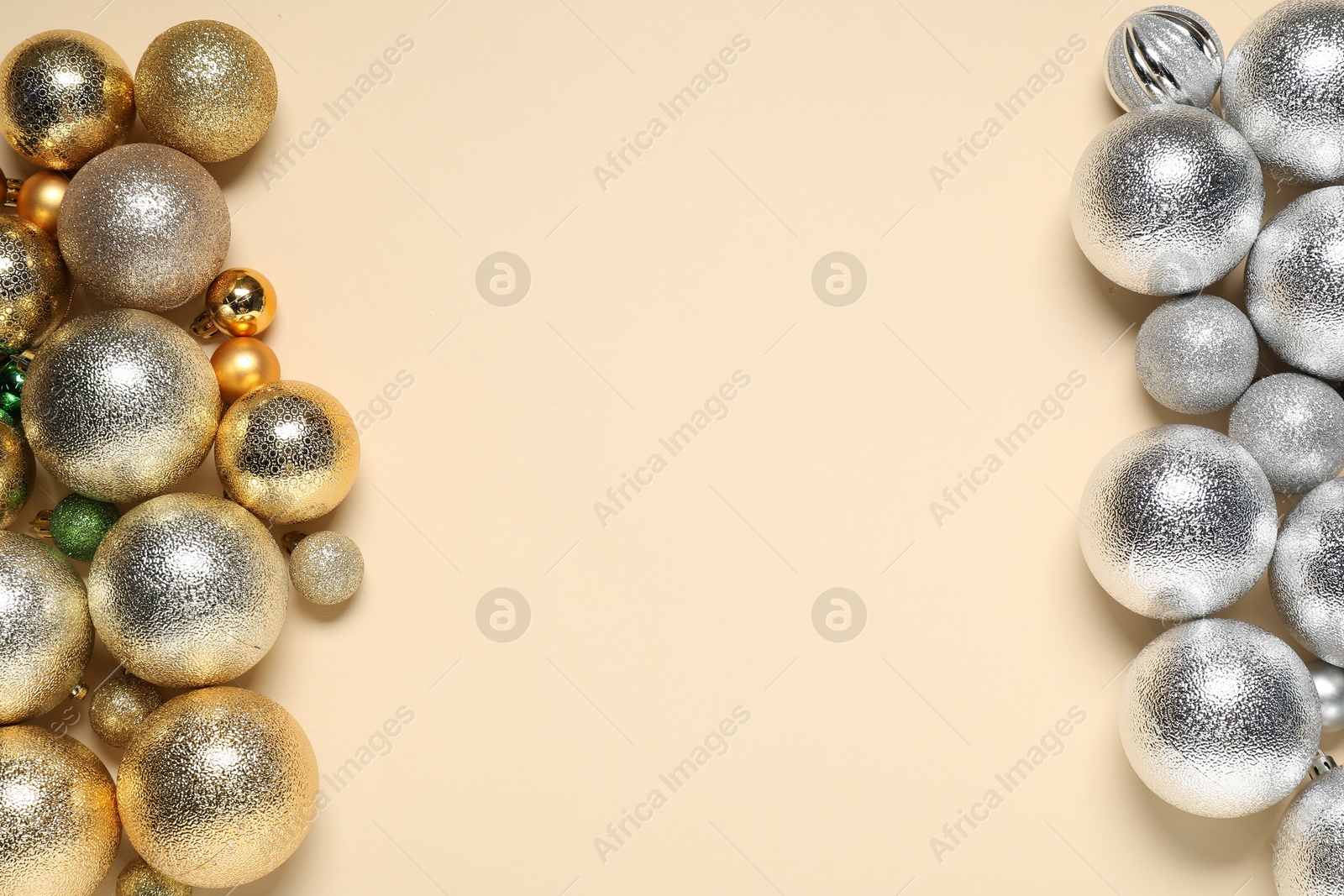 Photo of Different baubles on beige background, flat lay. Space for text