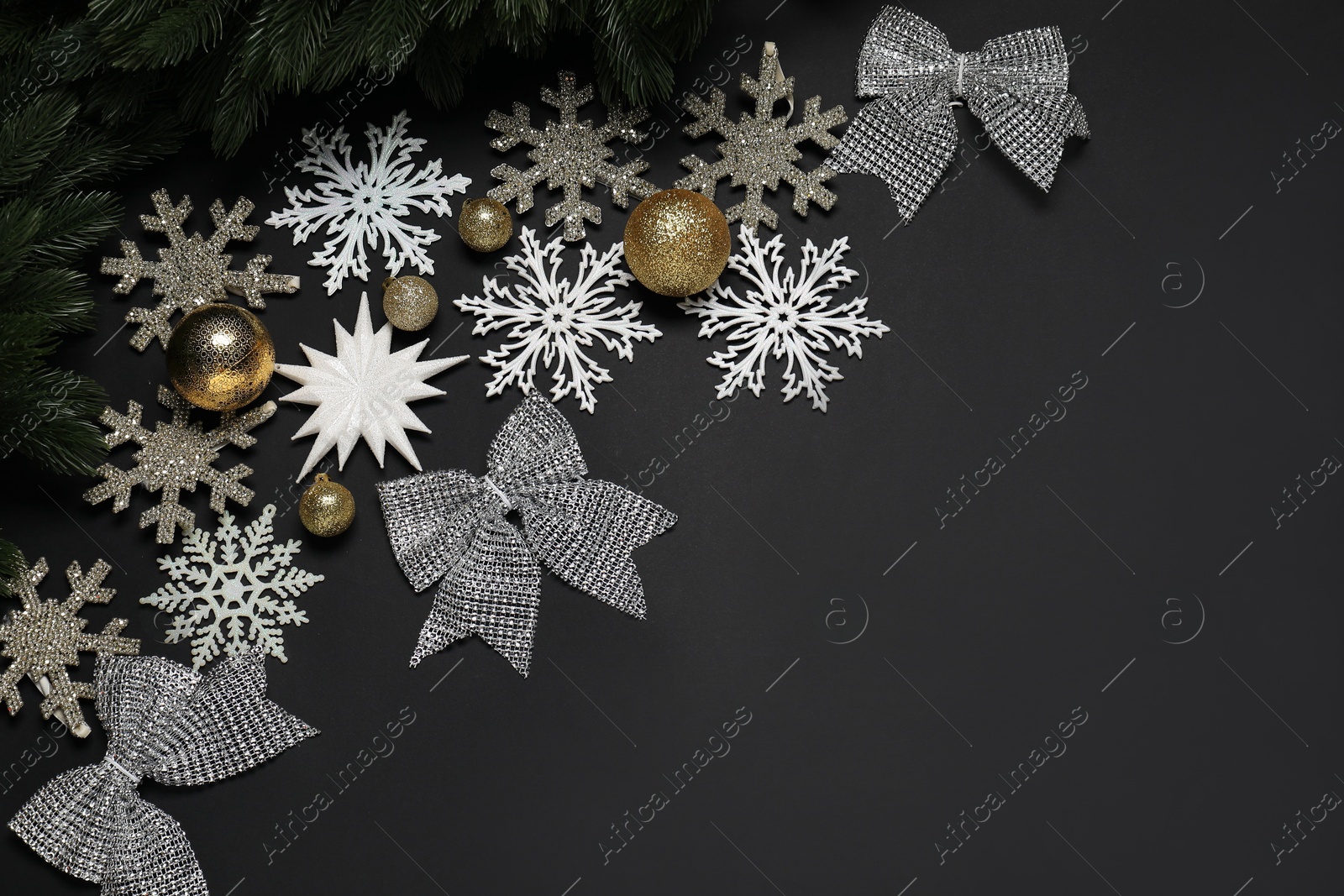 Photo of Different Christmas decor on black background, flat lay. Space for text