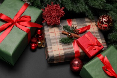 Photo of Christmas decor and gift boxes on black background