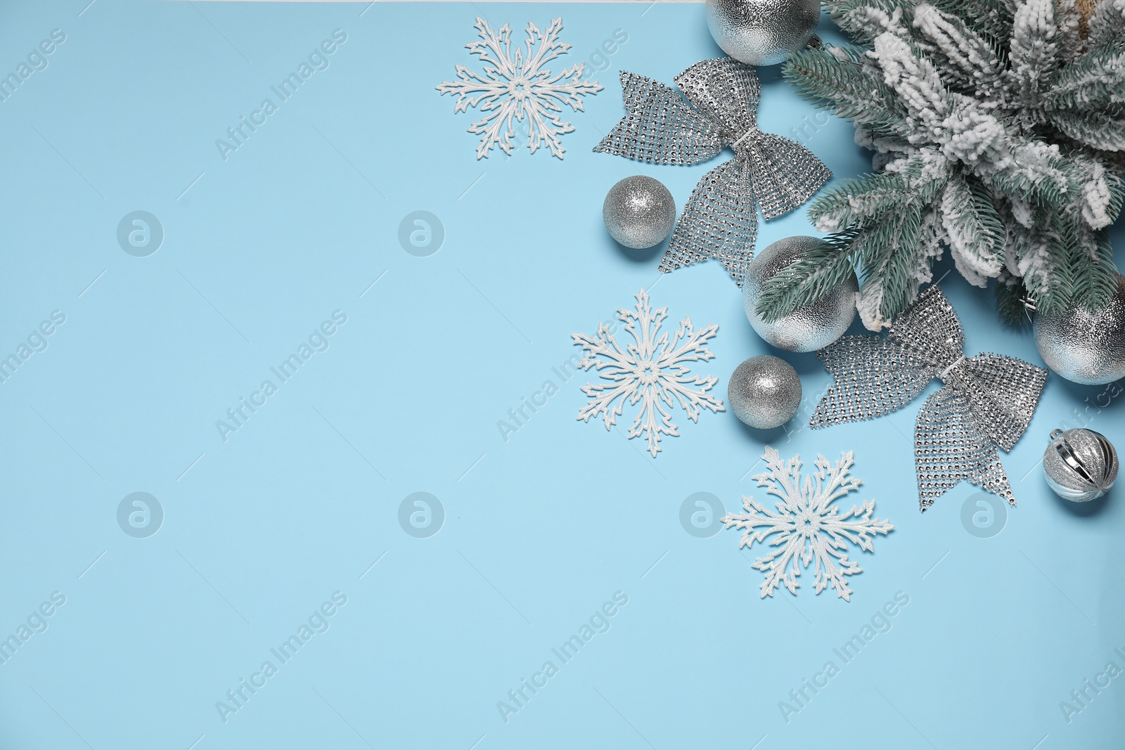 Photo of Different Christmas decor on light blue background, flat lay. Space for text