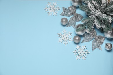 Photo of Different Christmas decor on light blue background, flat lay. Space for text