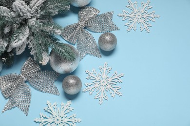 Photo of Different Christmas decor on light blue background, flat lay. Space for text