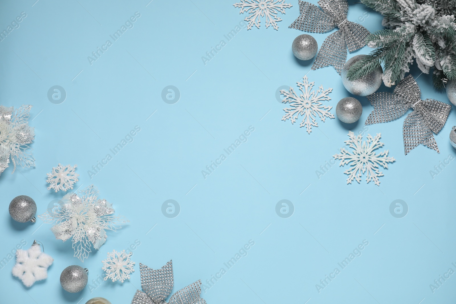 Photo of Different Christmas decor on light blue background, flat lay. Space for text