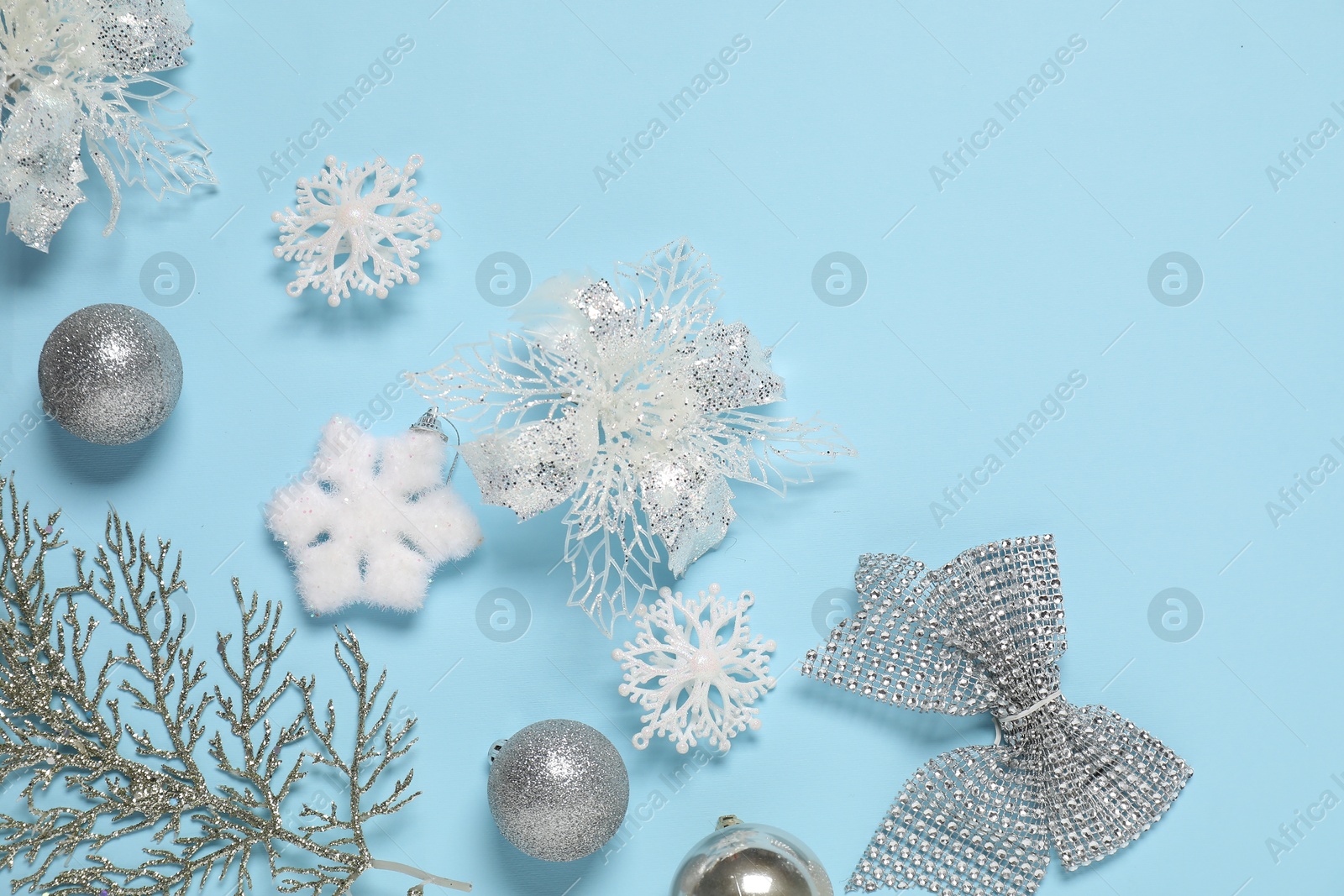 Photo of Different Christmas decor on light blue background, flat lay. Space for text