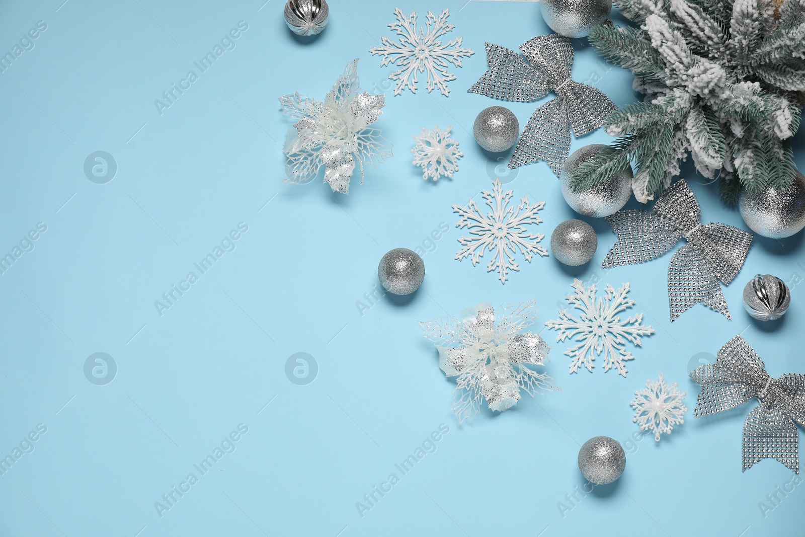 Photo of Different Christmas decor on light blue background, flat lay. Space for text