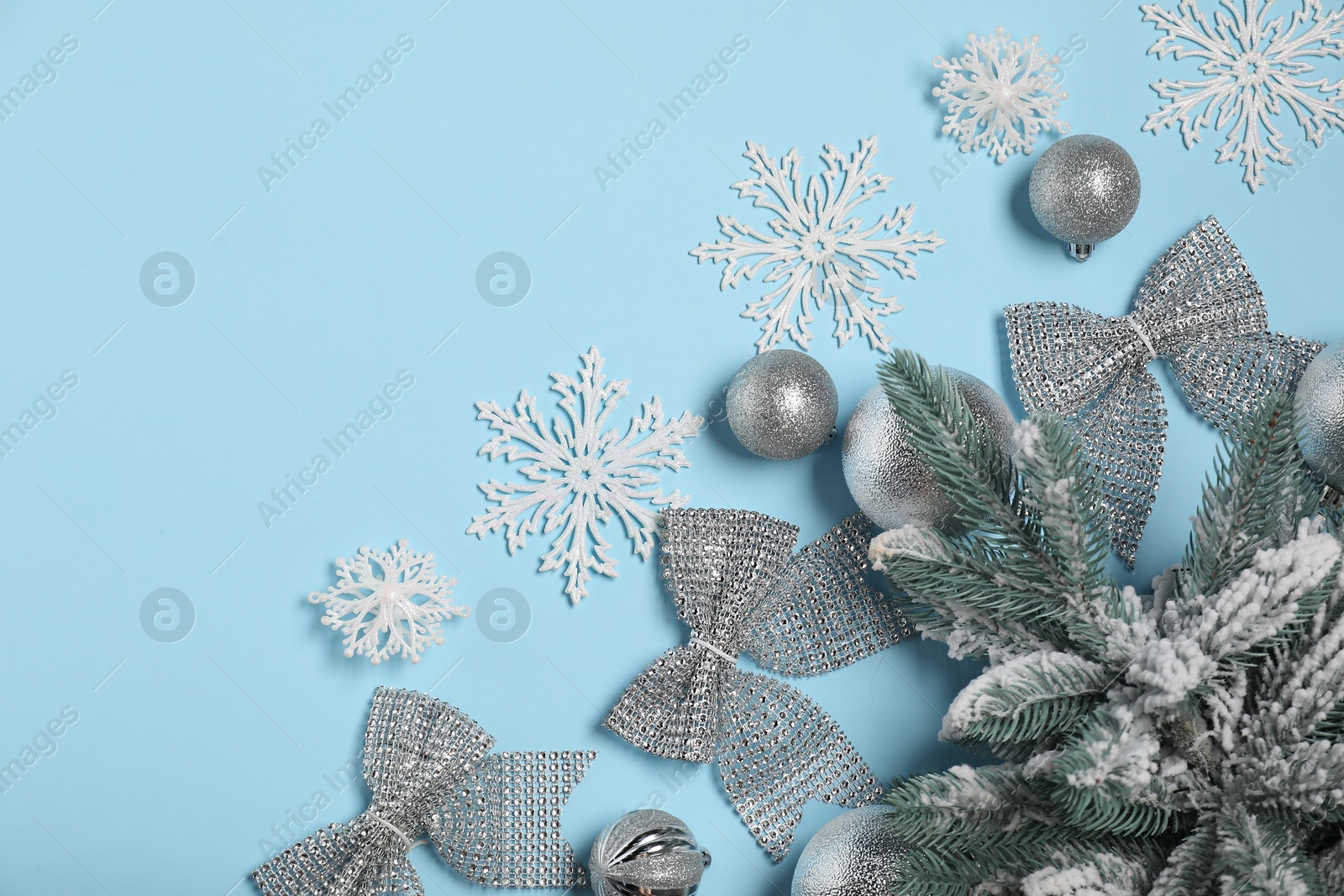 Photo of Different Christmas decor on light blue background, flat lay. Space for text