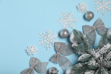 Photo of Different Christmas decor on light blue background, flat lay. Space for text