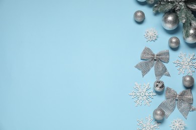 Photo of Different Christmas decor on light blue background, flat lay. Space for text