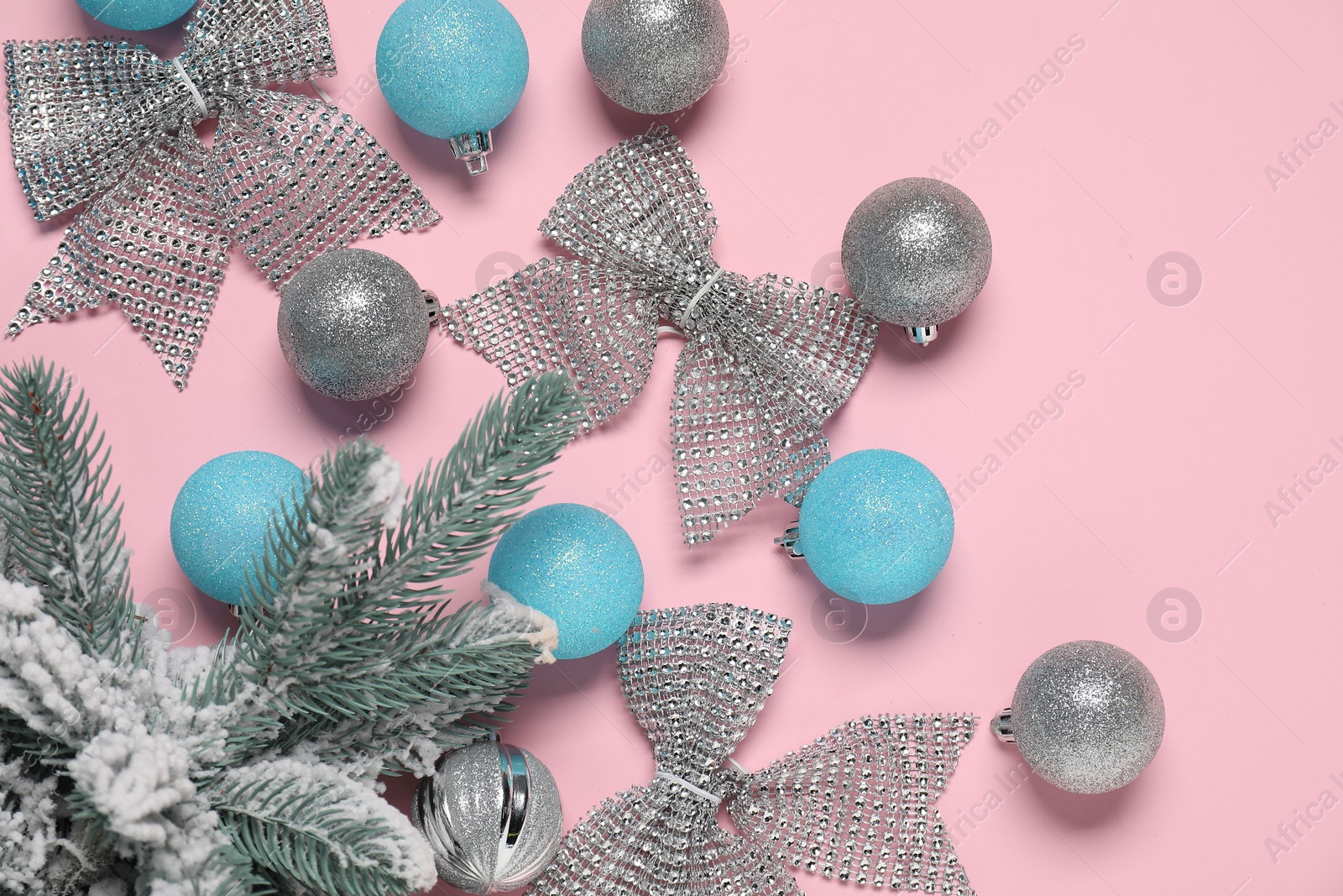 Photo of Flat lay composition with different Christmas decor on pink background