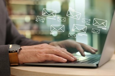 Image of Man using laptop at table, closeup. Illustrations of envelope over computer