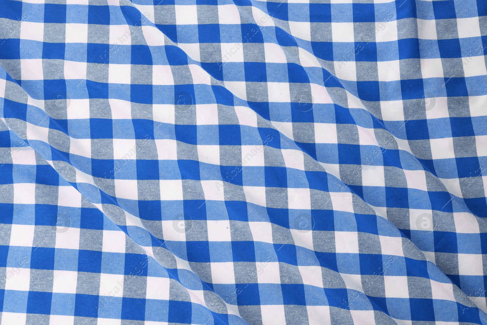 Image of Blue and white checkered gingham fabric as background, closeup