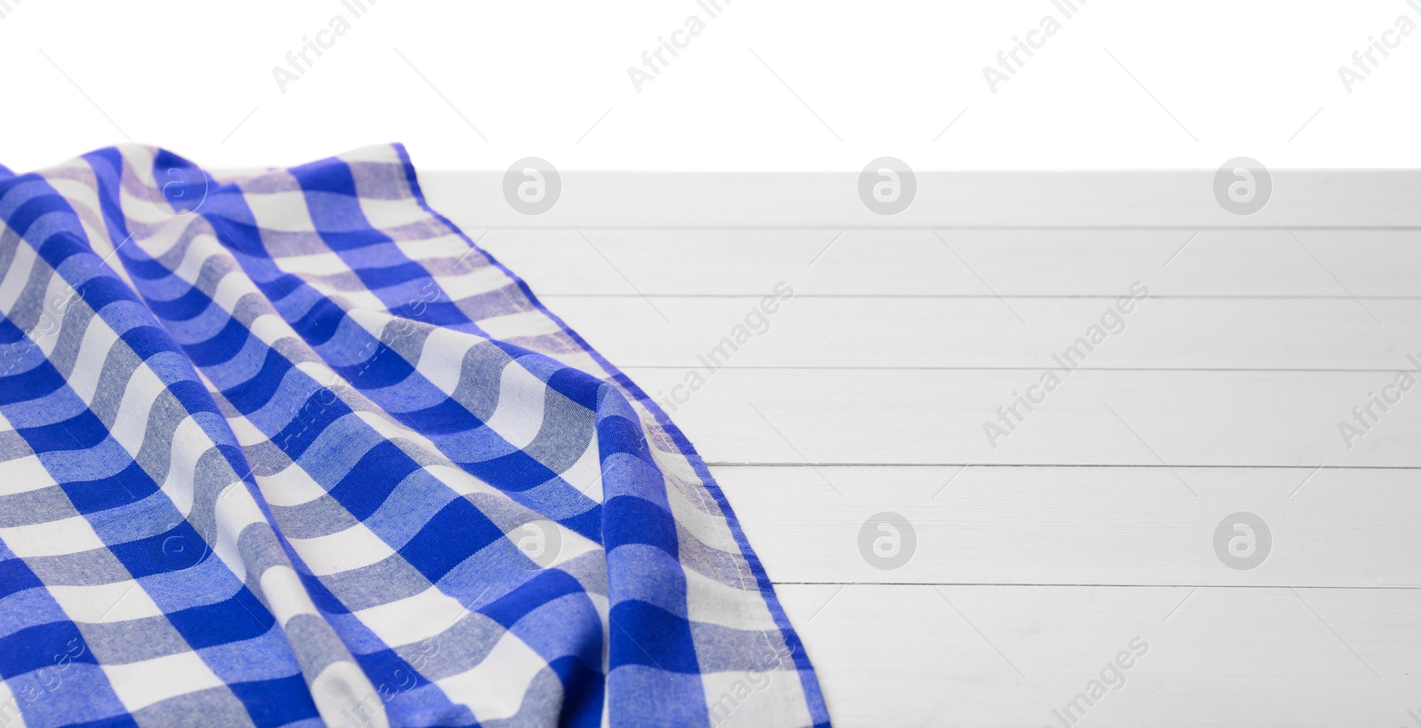 Image of Blue checkered gingham fabric on white wooden table