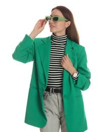 Photo of Beautiful woman in stylish green jacket and sunglasses on white background