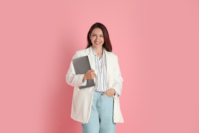 Beautiful woman in stylish white jacket on pink background