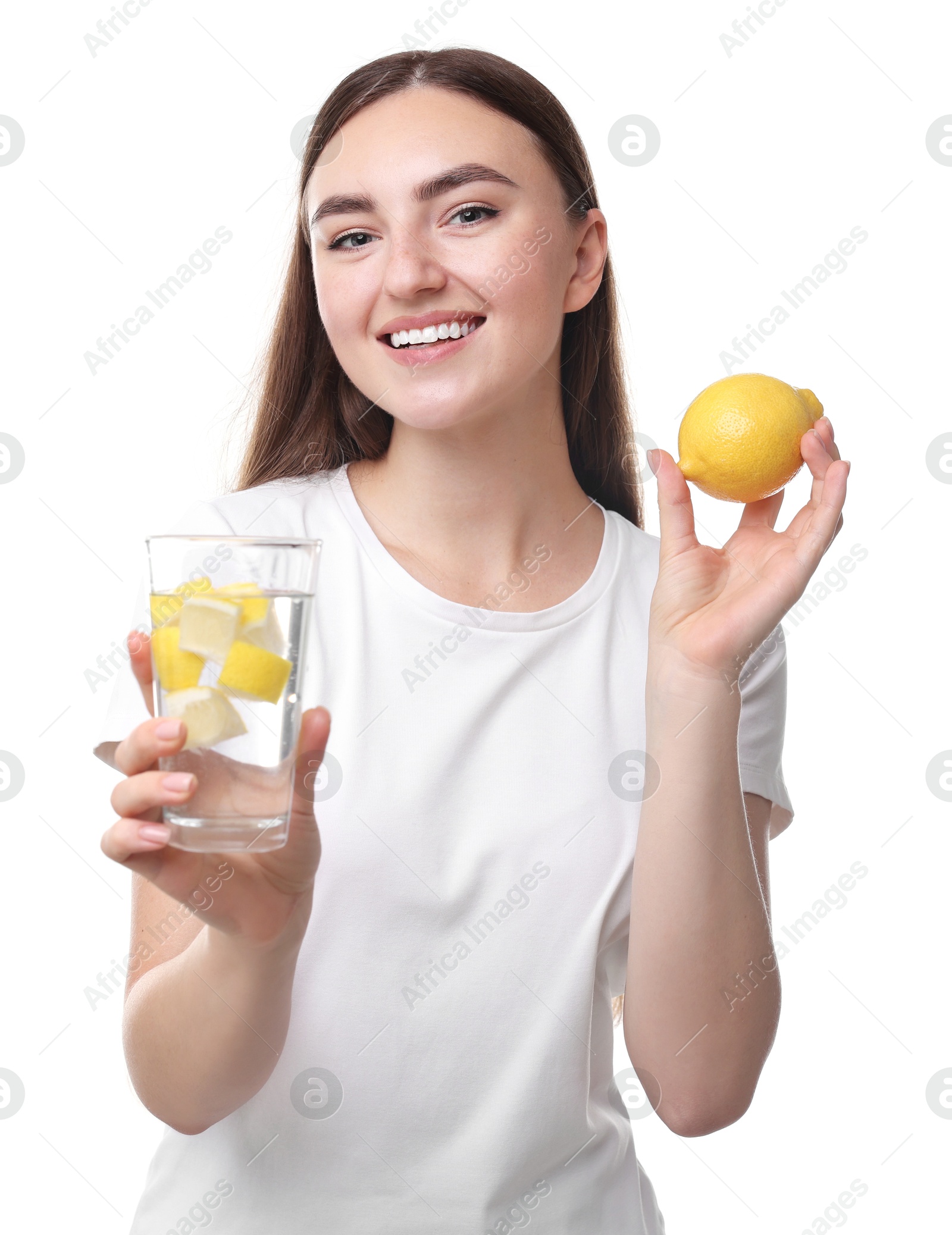 Photo of Woman with glass of lemon water and fruit on white background