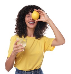 Happy woman with lemon water and fruit on white background