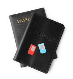 Passports and SIM cards isolated on white, top view