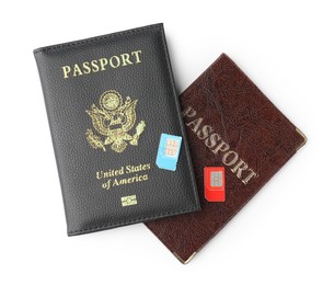 Photo of Passports and SIM cards isolated on white, top view