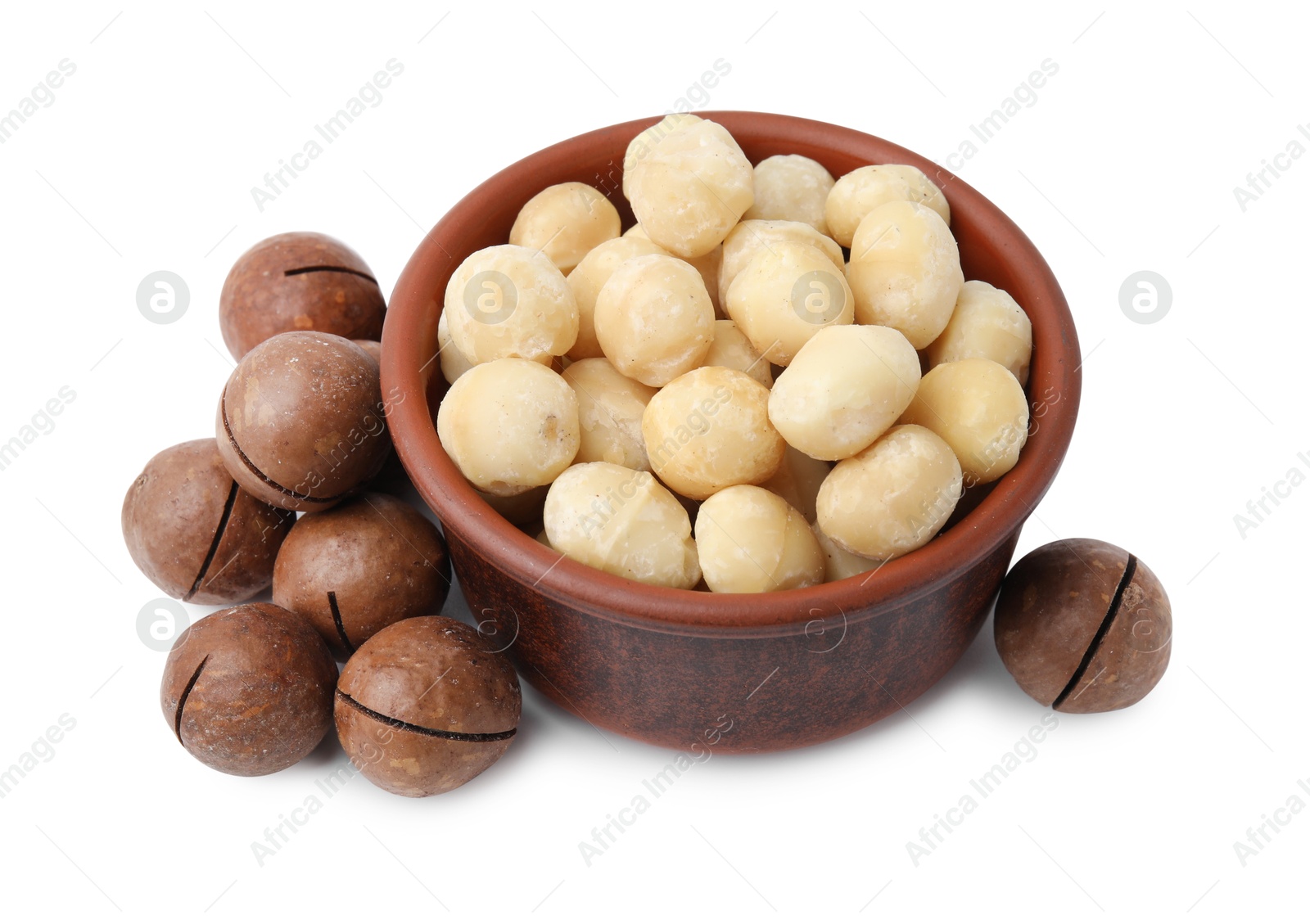 Photo of Macadamia nuts in bowl isolated on white