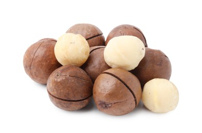 Photo of Macadamia nuts with shells isolated on white