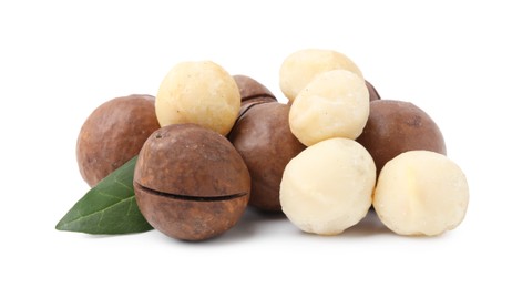 Photo of Macadamia nuts with shells isolated on white