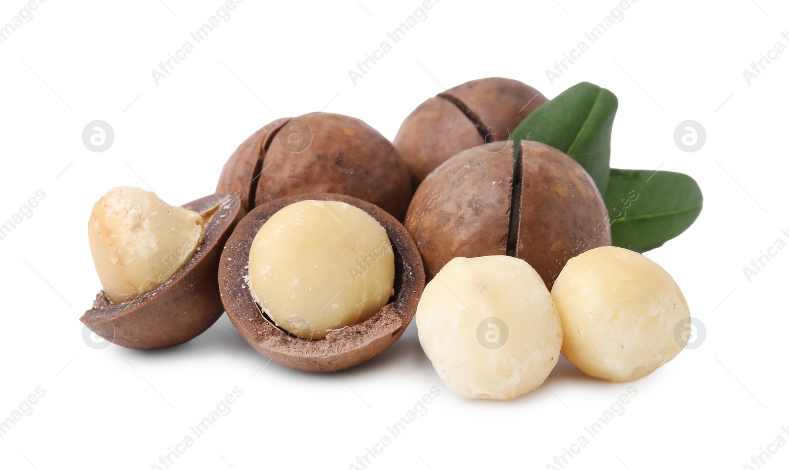 Photo of Macadamia nuts with shells isolated on white