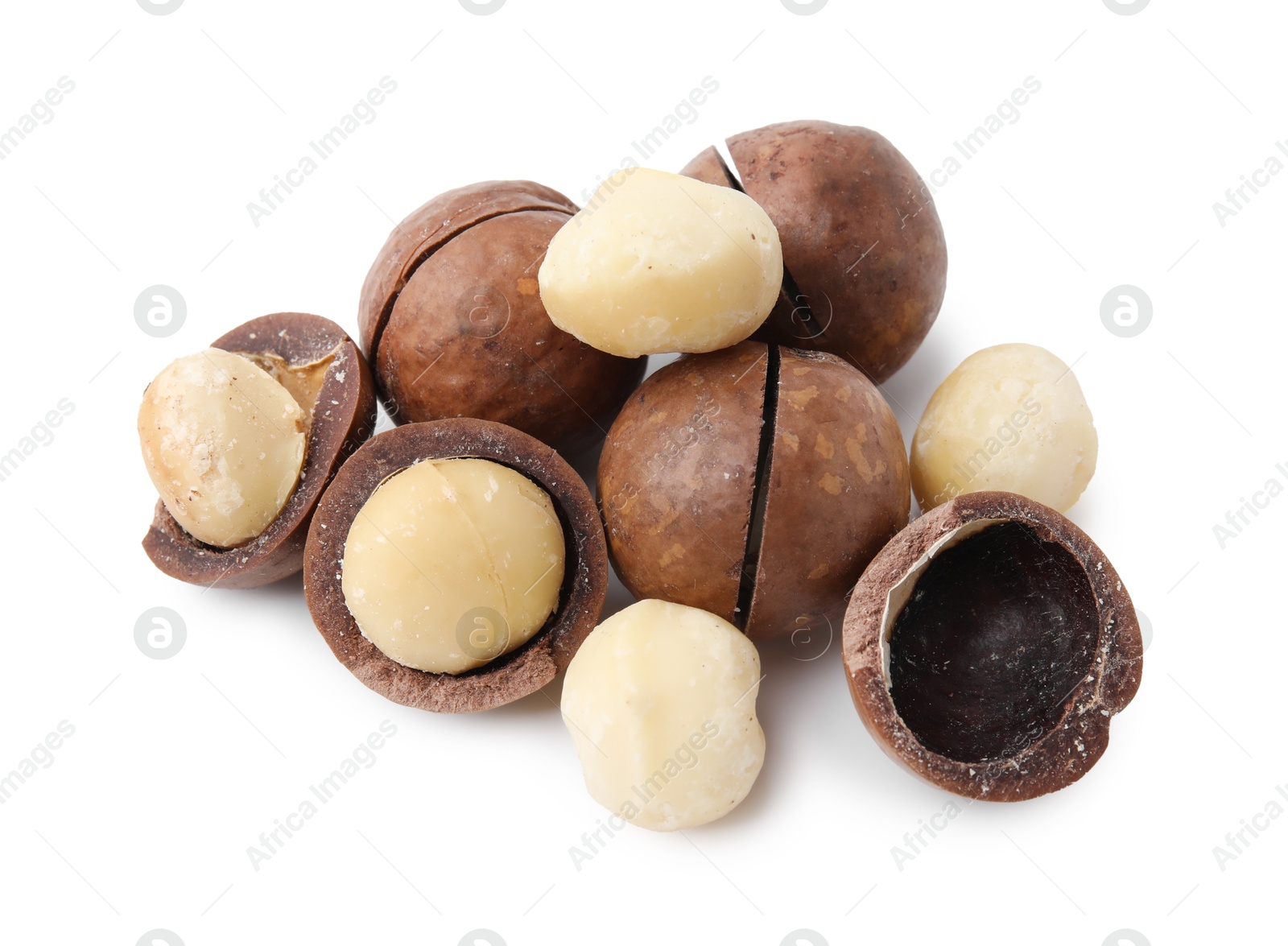 Photo of Macadamia nuts with shells isolated on white